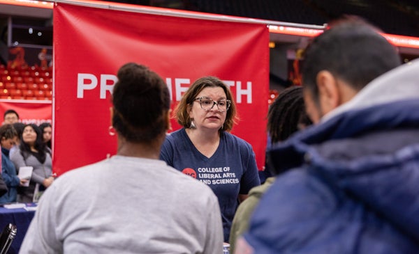 Pre-Health Advisor Anya Cruz speaking to students at event