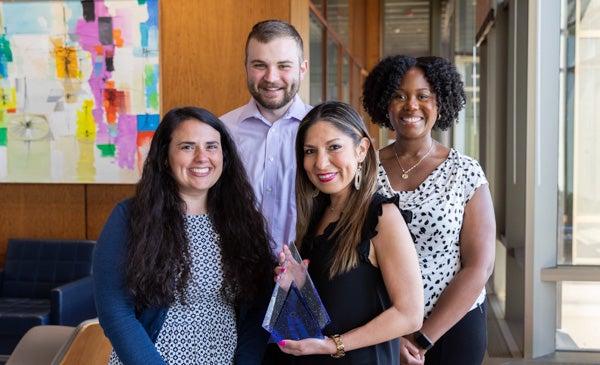 Liz Herrera and team with their NAACE award